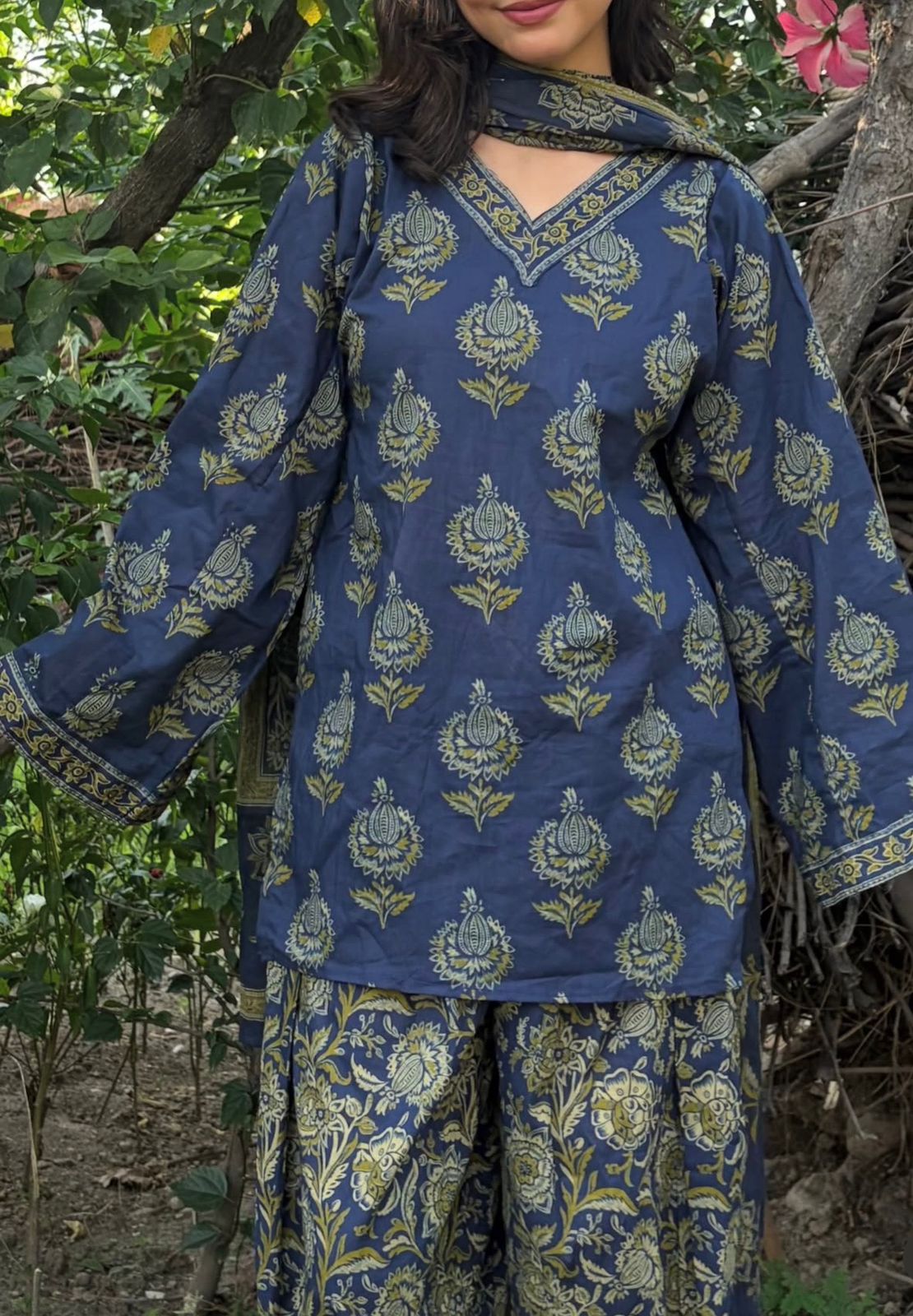 Vasudha hand block Kalamkari cotton kurta set in navy and gold with matching salwar and dupatta — outdoor lifestyle front view