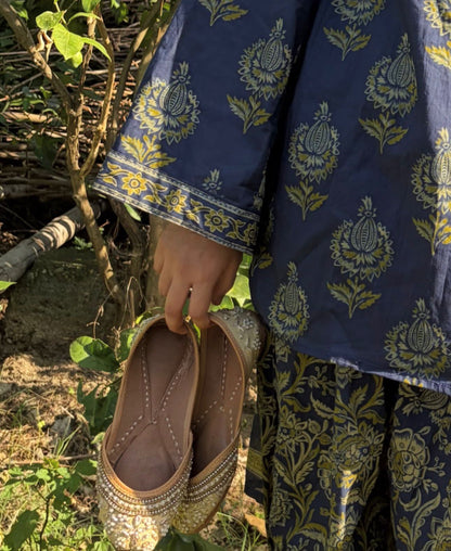 Vasudha navy Kalamkari 3-piece kurta set styled outdoors with dupatta draped — natural light lifestyle shot
