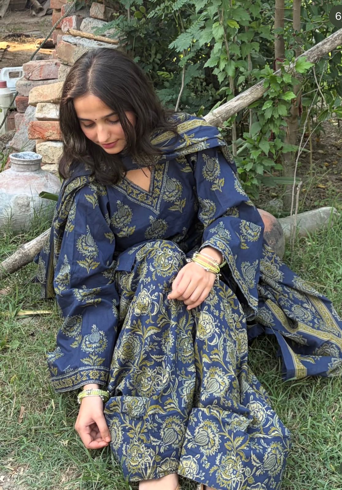 Close-up of hand block Kalamkari botanical floral print on navy cotton fabric of Vasudha kurta set