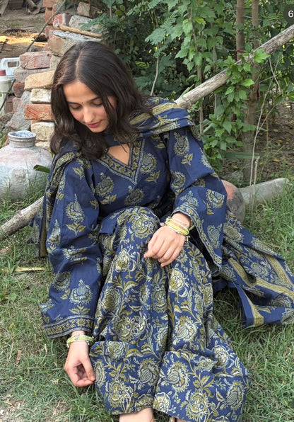 Close-up of hand block Kalamkari botanical floral print on navy cotton fabric of Vasudha kurta set