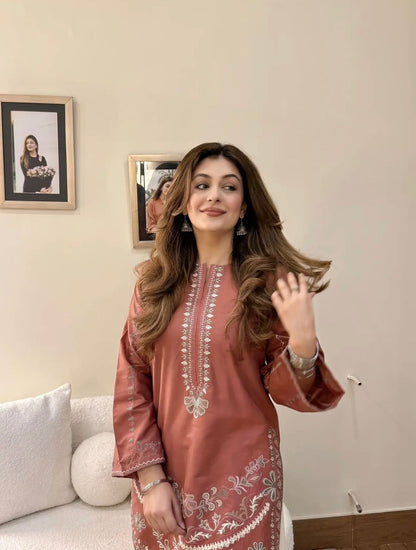 Gulrang embroidered cotton modal kurta with wide-leg pants — dusty rose kurta with band collar and floral embroidery, cream pants with embroidered hem, front view
